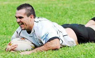 New Bellingen coach Ryan O’Connor scoring a try in this year’s match. New Bellingen coach Ryan O’Connor scoring a try in this year’s match.